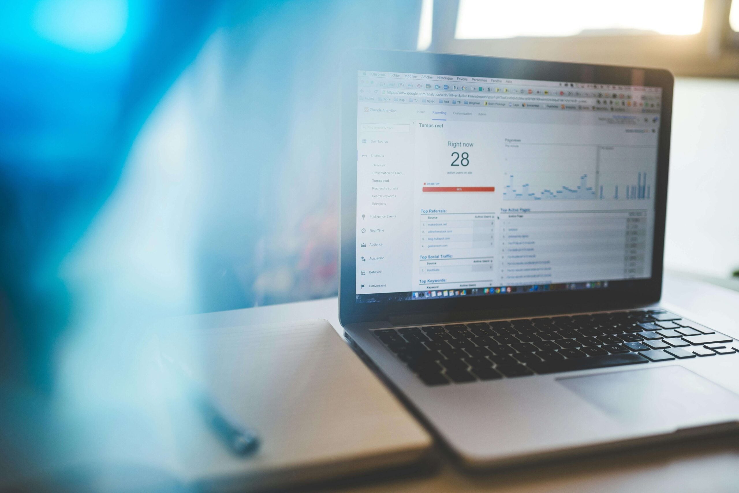 laptop on a desk showing analytics