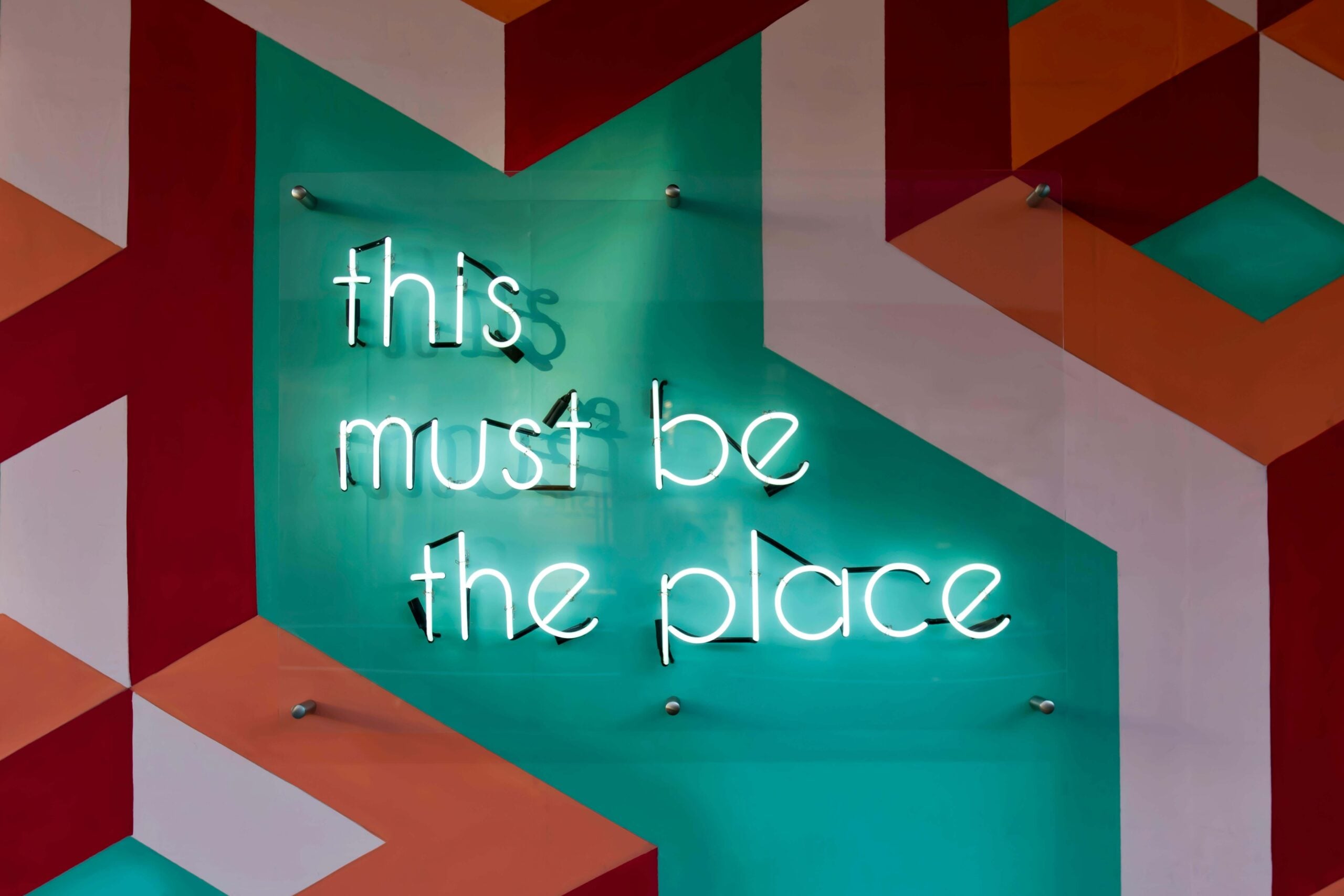 illuminated sign saying - this must be the place