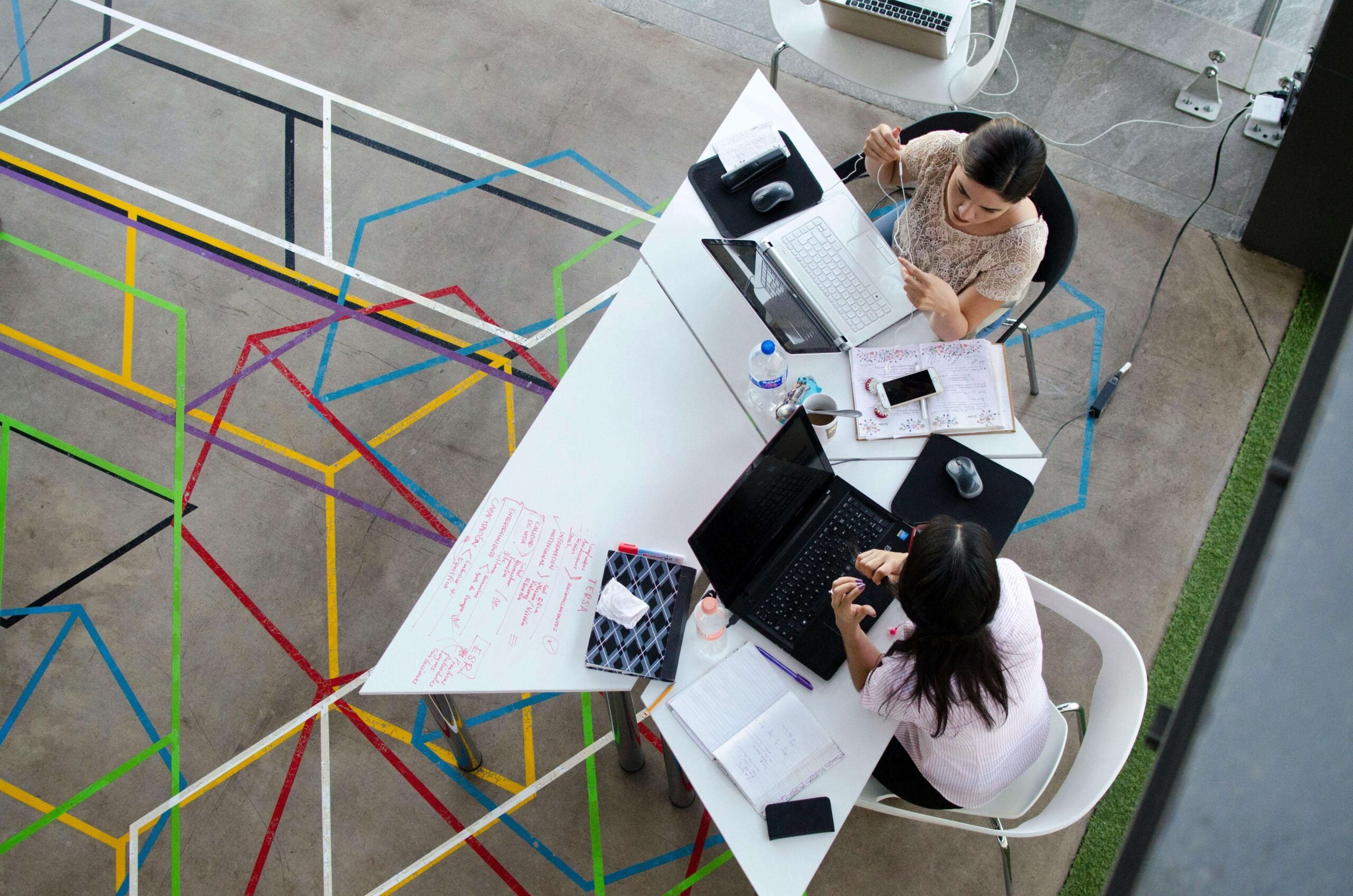 two people working at a desk